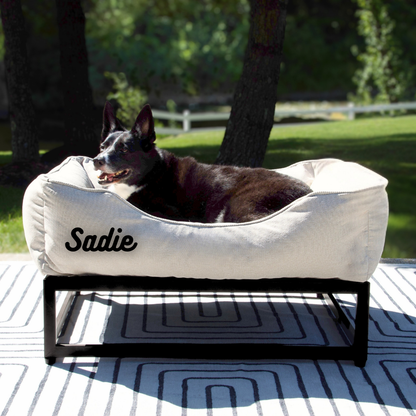 The FÜZI Elevated Dog Bed – Oat Performance Fabric on Black Metal Base (S/M/L/XL)